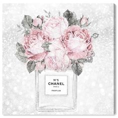 a chanel perfume bottle with pink roses on the front and white glitters in the background