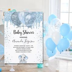 an elephant themed baby shower with blue and white balloons, streamers and confetti