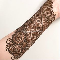 a henna tattoo is shown on someone's arm