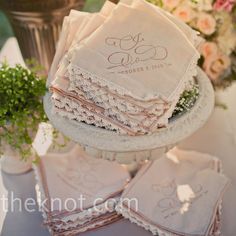 wedding handkerchiefs and napkins on a cake stand