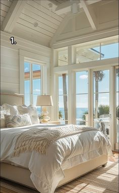 a large bed sitting in a bedroom next to a window with lots of light on it