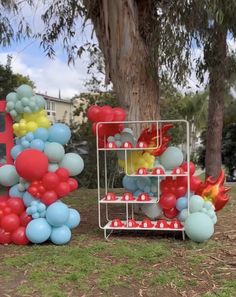 balloons are arranged in the shape of letters and numbers on display at an outdoor event