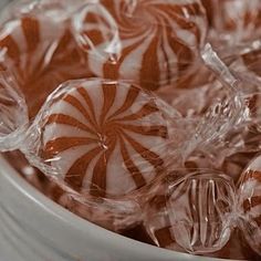 a bowl filled with lots of candy canes