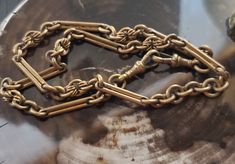 A beautiful antique gold gilt over brass watch chain with 2 dog clips  Most of the gilding is gone, could use a polish. Measures 18 1/4 inches in length, 7-8 mm at widest points. Clasps work great. Antique Gold Brass Chain Necklace, Antique Gold Chain Necklace In Brass, Antique Gold Chain Necklace With Lobster Clasp, Victorian Gold Link Chain Necklace, Victorian Style Gold Link Chain Necklace, Antique Oval Link Chain Necklace, Victorian Gold Chain Link Necklace, Victorian Gold Jewelry With Hooks And Links, Antique Bronze Chain Necklace