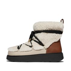 A statement take on the 'cozy sheepskin boot', these are luxe, directional, and will warm up your freezing feet. Chunky-soled. Crafted in premium curly shearling, inside and out, that’s breathable, thermoregulating and fabulously soft. With contrast tubular megalaces crisscrossing the front, adding a graphic edge. Leather detail includes logo’d pull tabs and wraparound panels to help keep out water. On our cloud-like Microwobbleboard™ midsole for all-day comfort. Easy to pull on, hard to take of Logo D, Lace Ankle Boots, Adjustable Sandals, Clog Boots, Natural Movement, Sheepskin Boots, Leather Detail, Metal Lace, Trainer Boots