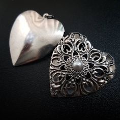 "Presenting this beautiful Ornamental Silver Heart Locket as sentimental gift ideas where you can personalize and attach to a necklace to give to that special person in your life or for you to keep a special memory close to your heart. Features: - Intricate ornamental design with pearl in the center -Elegant and classic looking locket -Made of Metal -Measurements: Approximately 1.75\" x 1.5\"" Handmade Heart-shaped Jewelry For Wedding Gift, Sentimental Gift Ideas, Silver Heart Locket, Ornamental Design, Lace Mask, Silver Locket, Antique Pendant, Photo Locket, Silver Lockets