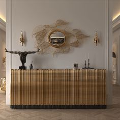 an elegant reception area with gold and black decor on the wall, along with a sculpture of a man's head