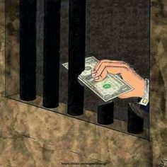 a person holding money in their hand behind bars