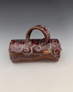 a small brown purse sitting on top of a table