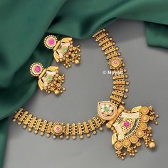 Indian dull gold jewelry set with beautiful meenakari designs. Inspire your style with this real gold look wedding jewlery set with ruby and green stone details. Necklace is made with pure brass in antique gold finish. Pair this necklace with saree or lehenga to complete your look.  All orders Ship same day if placed before 4:00 PM EST  Earring length: 1.45 inch Earring width: 1.25 inch Necklace length: Adjustable with dori closure. Create beautiful memory for any occasion with elegant jewelry f Green 22k Gold Jewelry Set For Wedding, Green 22k Gold Wedding Jewelry Set, Green 22k Gold Temple Necklace For Wedding, Traditional Kundan Necklace For Marriage With Meenakari, Traditional Kundan Necklace With Meenakari For Marriage, Traditional Green Necklaces For Marriage, Gold Zari Work Jewelry For Marriage, Temple Jewelry Kundan Necklace With Meenakari For Marriage, Temple Jewelry Sets For Marriage With Meenakari