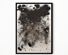 a black and white painting hanging on the wall