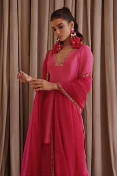 Hot pink silk kurta with mirror and kasab embroidery. Comes with palazzo and an organza dupatta. - Aza Fashions Bollywood Silk V-neck Sets, Pink V-neck Kurta With Zari Work, Bollywood Style Silk V-neck Kurta, Silk V-neck Kurta With Dupatta, Party Cotton Silk Palazzo Set, Designer Silk Palazzo Set With Mirror Work, Elegant Sharara With Mirror Work In Slub Silk, Designer Silk Palazzo Set, Elegant Slub Silk Sharara With Mirror Work