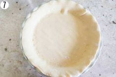 an uncooked pie crust in a glass bowl