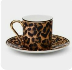 a leopard print coffee cup and saucer