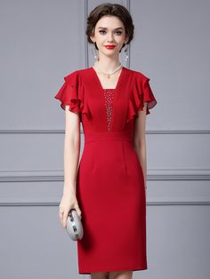 Hail the arrival of elegance with this stunning mother of the bride dress! Radiant in red, this dress features a bodice adorned with shimmering embellishments that lead the eye to a V-neckline, offering a touch of glamour without sacrificing modesty. The fluttering ruffle sleeves add a playful yet graceful touch, perfect for a day of love and celebration. Crafted with a focus on fit, the dress cinches at the waist before giving way to a streamlined skirt that skims the knees. Ita dress designed not just for looking beautiful but for celebrating the day with confidence and comfort. This dress isn't just an outfit, it's a keepsake that honors the role of the mother on a day as special as her child's wedding. Chic Red Dress With Flutter Sleeves, Luxury Red Knee-length Dress, Luxury Red Short Sleeve Midi Dress, Elegant Red Floor-length Mother Of The Bride Dress, Fit Mother, Elegant Red Midi Dress With 3/4 Sleeves, Crystal Wedding Dress, Brides Dress, Floor Length Wedding Dress