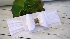 "WHITE BOW HEADBAND --->> MANY COLORS AVAILABLE <<--- Please see link: https://www.etsy.com/shop/BySophiaBaby/search?search_query=715&order=date_desc&view_type=gallery&ref=shop_search -->> FREE SHIPPING!! <<-- *BOW HEADBAND DESCRIPTION*: - Unique Handcraft Bow placed on a 2\" comfortable stretchy Nylon Headband with Rhinestone embellishment in the center. - Bow size is approximately 3\"x 2\" - This Headband is perfect for any occasion, Weddings, Flower Girls or just a day at the park. - Mix & Ma White Adjustable Wedding Sashes, Elegant White Headband With Ribbon, White Satin Bow Headband, Adjustable White Headband For First Communion, Elegant Adjustable Headband For Baptism, Christening Headband Baby Girl, White Baby Headband, Rose Baby Headband, Baptism Headband