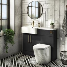 a white toilet sitting next to a black and white checkered floor in a bathroom