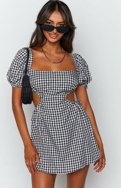 This flirty little number is perfect for those sunny days and warm nights. With its classic gingham print, it’s giving major picnic-in-the-park vibes, but the cut-out back adds just the right amount of sexy. Whether you’re heading to brunch with the girls or a cute date night, this dress is your go-to for effortless style. Pair it with your favorite sandals or sneakers, and you’re ready to slay the day! Fit and Features Open back that ties Mini length Puff sleeves Ties on the sides Runs true to Line Dresses, Sundress Dress, A Line Dresses, Short Sleeve Mini Dress, Tie Dress, Fashion Colours, Mini Dress With Sleeves, Bodycon Mini Dress, Summer Dresses For Women