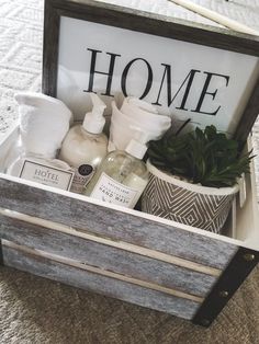 a wooden crate filled with personal care items on top of a carpeted floor next to a sign that says home