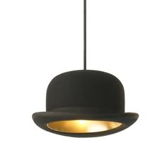 a black hat hanging from a light fixture