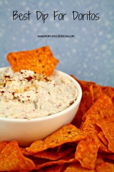 the best dip for tortillas is in a white bowl with chips around it