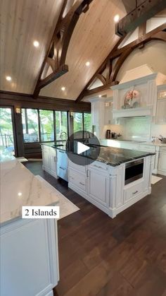 a large kitchen with white cabinets and wood flooring is pictured in this image from the inside