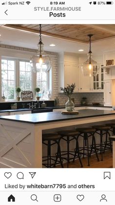 a kitchen with an island and bar stools