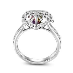 If you're looking for the perfect personalized gift, this customized ring is sure to please. Made in sterling silver, this ring is a special gift for any special occasion. The large cage size allows space for up to 6 dazzling heart cut birthstones to make the ring even more special. Jewelry makes a great gift - surprise your loved ones with this ringany time of the year.Carat Weight: 2.57 ctStone Size: 4*4 mmStone Type: Jeulia® StoneNumber of Stones: 6 Stone Color: Peridot Green, Amethyst Purple Fine Jewelry Ring With Rotating Bezel, White Gold Jewelry With Rotating Bezel As Gift, Sterling Silver Keepsake Rings, Sterling Silver Rings With Rotating Bezel For Gifts, Silver Heart Ring With Accent Stones As Gift, Open Heart Birthstone Jewelry For Promise Ring, Silver Keepsake Ring, Silver Birthstone Ring With Halo Setting As Gift, Silver Heart Ring With Prong Setting As Gift