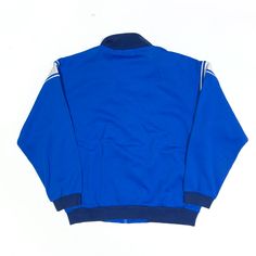 Item is in good used condition. >Size: L >Armpit To Armpit: 21" >Armpit To Cuff: 18" >Collar To Hem: 23" Vintage Blue Track Jacket With Pockets, Vintage Blue Long Sleeve Windbreaker, Vintage Blue Outerwear For Sports, Vintage Blue Track Jacket For Streetwear, Blue Vintage Track Jacket For Streetwear, Vintage Blue Track Jacket For Winter, Blue Long Sleeve Windbreaker With Ribbed Cuffs, Vintage Blue Long Sleeve Track Jacket, Retro Blue Cotton Track Jacket