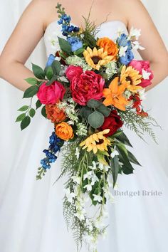 a bride holding a bouquet of flowers in her hands