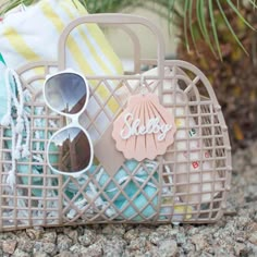 a basket filled with sunglasses and beach towels