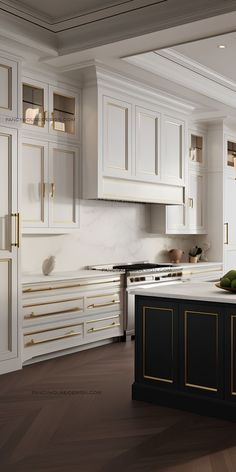 a kitchen with white cabinets and gold trim