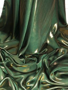 the green fabric is very shiny and smooth