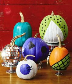 several pumpkins with different designs on them