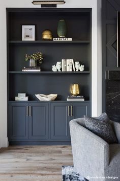 a living room filled with furniture and bookshelves on top of it's shelves