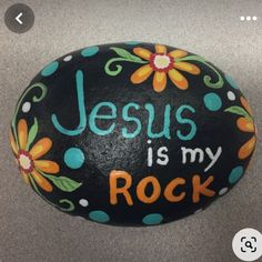 a painted rock that says jesus is my rock