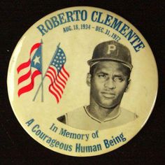 a baseball player's badge with an american flag and the name roberto clemente