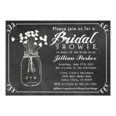 a chalkboard bridal shower with flowers in a mason jar