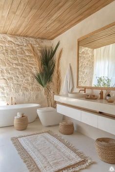 a bathroom with a bathtub, sink and rugs on the floor in front of it