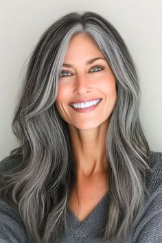 Save this pin for the best silver hair color ideas. Rock this edgy gunmetal silver mane for major impact! The deep, smoky tones blend multiple shades of charcoal and silver for a stunning effect. Older Women Gray Hairstyles, Transitions To Gray Hair, Silver And Brunette Hair, Dimensional Grey Hair, Gray Hair With Platinum Highlights, Natural Salt And Pepper Hair Women, Silver Hair On Brown Skin, Eyebrow Color For Gray Hair, Going Grey Hairstyles