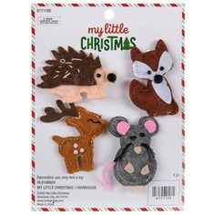 three little felt animals are in the package for christmas decorations, including an animal and a mouse