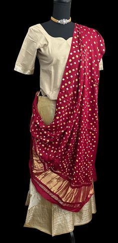 Pure Mangalagiri Silk Cotton Lehenga with pen kalamkari silk cotton Dupatta. Silk Cotton Lehenga with zari borders. Lined skirts and blouse , double lined. Color : beige  Fits ages -9 years to 12 years  Blouse size : length 18 inches  blouse chest - 32 goes upto 34 sleeve length -10 sleeve around - 14 Skirts - 39 inches long hip size 32 inches  Duppatta: pen kalamkari hand painted  silk dupatta Traditional Fitted Pre-draped Saree For Navratri, Transitional Art Silk Lehenga With Bandhani Print, Navratri Cotton Silk Choli With Dupatta, Cotton Silk Choli With Dupatta For Navratri, Bollywood Style Festive Pre-draped Saree With Kalamkari Print, Traditional Lehenga With Zari Work In Cotton Silk, Traditional Cotton Pre-draped Saree With Zari Work, Traditional Cotton Silk Lehenga For Festive Occasions, Festive Kalamkari Print Pre-draped Saree