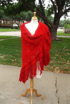 Beautiful candy apple red crochet shawl with a border, made with bulky yarn for warmth.  Call this shawl "plus size" or call it "Hippie".  It looks great either way on any adult frame.  It can take the place of a light-weight jacket.  Fringe is left uneven on purpose.  Length varies from 7"-11" and is knotted approximately 1"-2" from cut end.  When fringe ravels to marked knot, it will make for an even more beautiful shawl.  Border resembles small triangle panels as it advances in width from edg Red Bohemian Shawl With Pallu, Red Bohemian Shawl Poncho, Red Cotton Bohemian Shawl, Red Shawl Scarf One Size, Handmade Red Shawl, One Size, Candy Apple Red, Bulky Yarn, Candy Apples, Red Apple