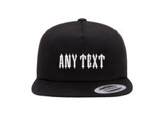 Elevate your hat game with this personalised TRAPSTAR inspired snapback cap. The sleek black polyester material paired with a twill fabric type and Yupoong brand ensures durability and style. The one size fits all design makes it suitable for both unisex adults, perfect for workwear, sports or casual occasions. The embroidered font style adds a touch of fashion and uniqueness to this cap. The TRAPSTAR theme is reflected through the design, making it a must-have for fashion enthusiasts. Take your Black 5-panel Snapback Hat With Letter Print, Black Trucker Hat For Skateboarding, Logo Print Snapback Trucker Hat For Streetwear, Custom Logo Snapback Baseball Cap, Custom Logo Snapback Baseball Cap For Streetwear, Streetwear Trucker Hat With Custom Logo And Flat Bill, Streetwear Trucker Hat With Custom Logo, Black Baseball Cap With Custom Logo, Streetwear Snapback Trucker Hat With Logo