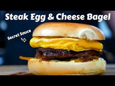 the steak egg and cheese bagel sandwich is ready to be eaten by someone else