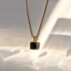 C R Y S T A L ∙ P E N D A N T ∙ N E C K L A C E Embrace the enigmatic allure of obsidian with this captivating dainty pendant necklace. This powerful stone, born from volcanic fire, is known for its ability to support: Protection, Grounding, and Spiritual Growth * Design: Square Crystal Pendant - Box Chain Necklace OR Beaded Chain Necklace * Material & Finish: 18K Gold Plated Brass * Pendant: Faceted Square Shape * Pendant Size (Approx.): 10 x 10 mm | 0.375 x 0.375 in * Necklace Length - 3 Options: 16in, 18in, 20in ** Your necklace may vary slightly due to the uniqueness of the stone B I R TH S T O N E ∙ A N D ∙ Z O D I A C * Birthstone: November * Zodiac: Varies Obsidian is a powerful protective stone, ideal for grounding and shielding. It provides clarity and self-awareness, benefiting a Timeless Faceted Jewelry For Gift, November Zodiac, Growth Design, Dainty Pendant Necklace, Obsidian Necklace, Square Crystal, Cleansing Crystals, Box Chain Necklace, Pink Envelopes