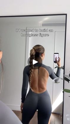 a woman taking a selfie in front of a mirror with the caption, if i wanted to build an hothouse figure