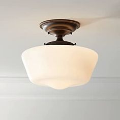 a light fixture hanging from the ceiling in a room