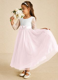 The Mae flower girl dress is a stunning A-line design that combines matte satin and delicate tulle with lace accents. Featuring an elegant illusion scoop neckline, long sleeves, and a stylish V-back with a zipper, it’s beautifully finished with charming bows, making it perfect for a fairytale wedding. Pink Flower Girl, Pink Flower Girl Dresses, Sage Dress, Ivory Flower Girl Dresses, Military Ball Dresses, Special Event Dresses, Lace Bride, Flower Girl Dresses Tulle, Ivory Dresses