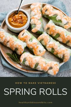 shrimp spring rolls on a plate with dipping sauce